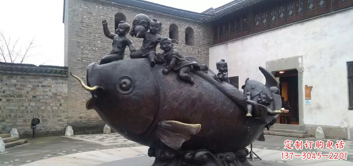 仙桃小孩骑鱼铜雕
